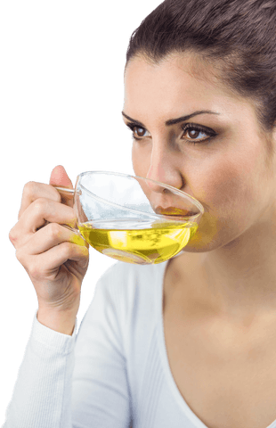 young woman sipping transparent herbal tea - Download Free Stock Videos Pikwizard.com