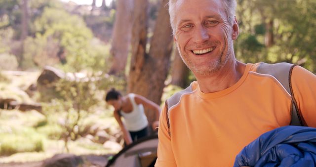 Happy Senior Man Enjoying Camping Trip Outdoors - Download Free Stock Images Pikwizard.com