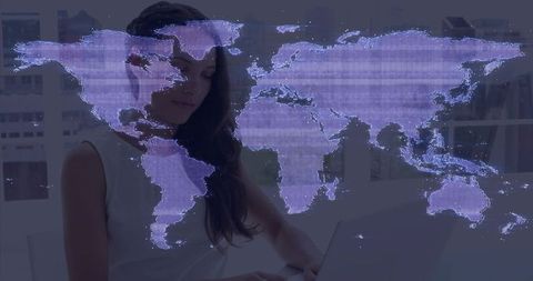 Woman typing on laptop with holographic purple world map conveying global connectivity