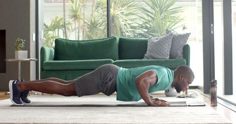 Stay Strong and Fit: Man Doing Push-Ups at Home