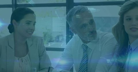 Executive team collaborating with futuristic HUD overlay during boardroom strategy meeting