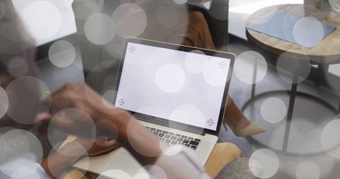 Casual Office Collaboration with Laptop and Smartphone