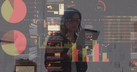 Businesswoman Analyzing Data on Interactive Digital Interface in Office