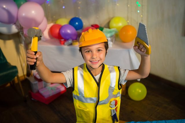 Boy pretending as a worker during birthday party at home