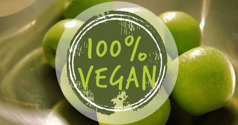 100% Vegan Label on Fresh Green Apples