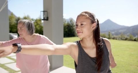 multigenerational women exercising outdoor in sunlit garden - Download Free Stock Images Pikwizard.com