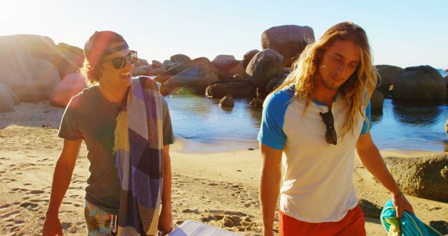 Two Young Men Enjoying Beach Walk at Sunset - Download Free Stock Images Pikwizard.com