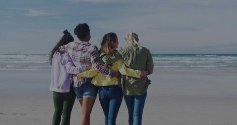 Diverse Group of Friends Embracing on Serene Beach