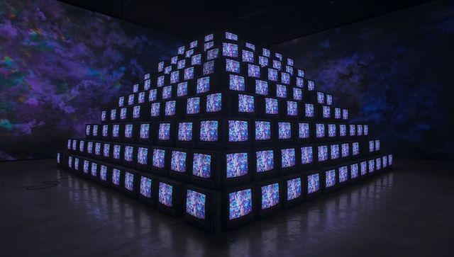 Multimedia pyramid of crt televisions featuring abstract art display