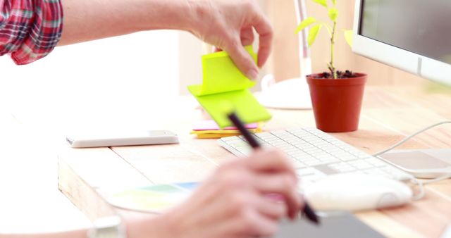 Man Working at Desk with Computer and Sticky Notes - Download Free Stock Images Pikwizard.com