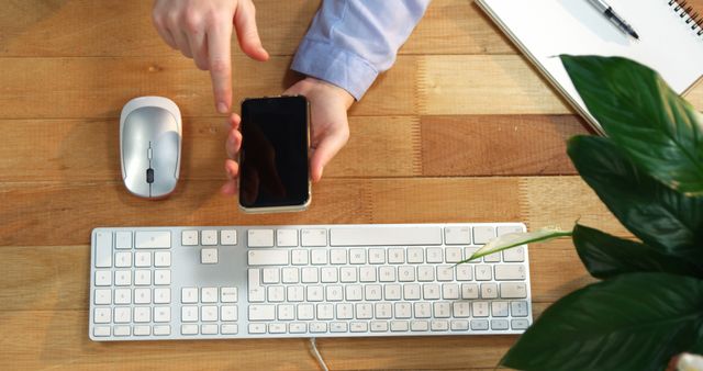 Office Worker Using Smartphone with Desktop Accessories in Workplace - Download Free Stock Images Pikwizard.com