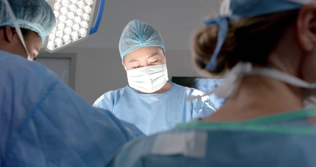 Focused Surgeon Performing Operation in Modern Operating Room - Download Free Stock Images Pikwizard.com