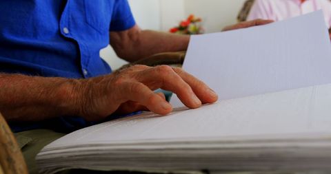 Blind Senior Man Reading Braille Book in Nursing Home - Download Free Stock Images Pikwizard.com