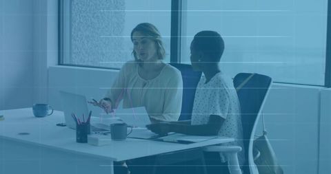 Two Professionals Collaborating on Project in Modern Office