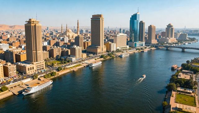 Nile river skyline featuring cairo skyscrapers, mosque minarets, riverboats, bridge and corniche