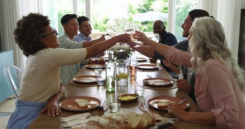 Diverse Group Toasting Elegant Wedding Reception