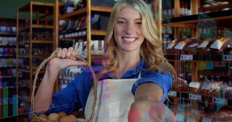 Happy store clerk holding basket of eggs in rustic grocery