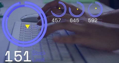 Hands typing on laptop keyboard displaying neon circular data visualization and stock limit metrics