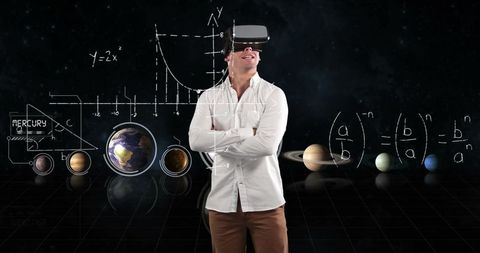 Man exploring virtual solar system with vr headset and graphs
