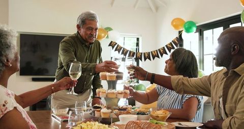 Senior Friends Toasting at Vivacious Retirement Gathering