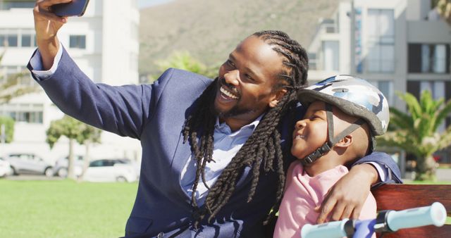 Smiling Father and Son Taking Selfie Outdoors - Download Free Stock Images Pikwizard.com