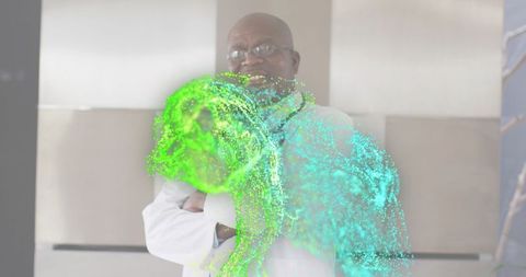 Senior scientist standing with crossed arms wearing lab coat with glowing particle swirl