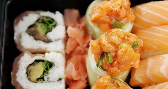 Close-Up of Assorted Sushi Rolls and Sashimi with Ginger - Download Free Stock Images Pikwizard.com