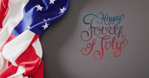 Happy Fourth of July Text with American Flag on Gray Background