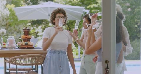 Joyful Outdoor Celebration with Champagne and Friends