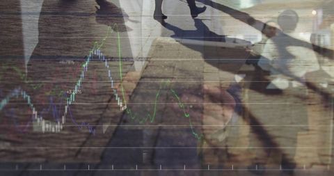 Holding smartphone overlaying financial charts and pedestrian cityscape data visualization