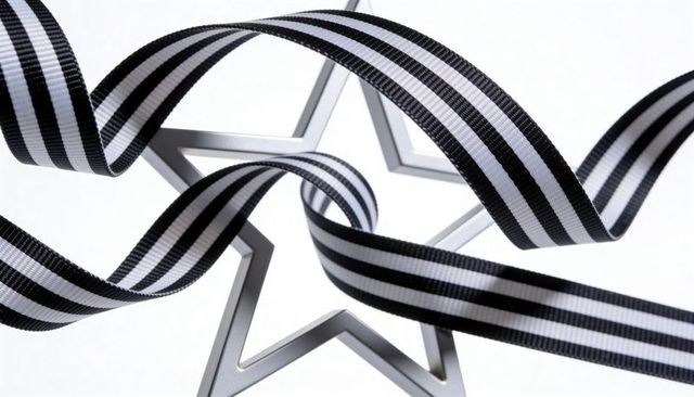 Metal star cookie cutter with black-and-white striped ribbon, high-key clean composition