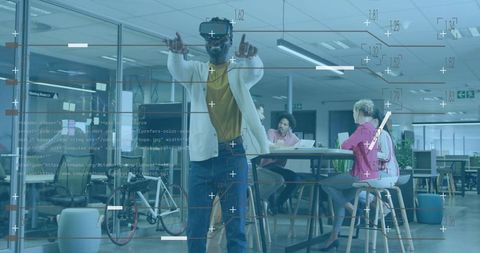 Creative professional exploring augmented reality interface in modern coworkorking space
