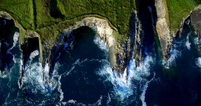 Aerial View Coastal Cliffs with Waves Crystal-Blue Sea Natural Wonder - Download Free Stock Videos Pikwizard.com