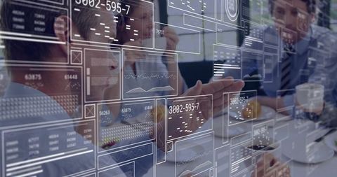 Business Team Collaborating with Digital Interface in Modern Meeting