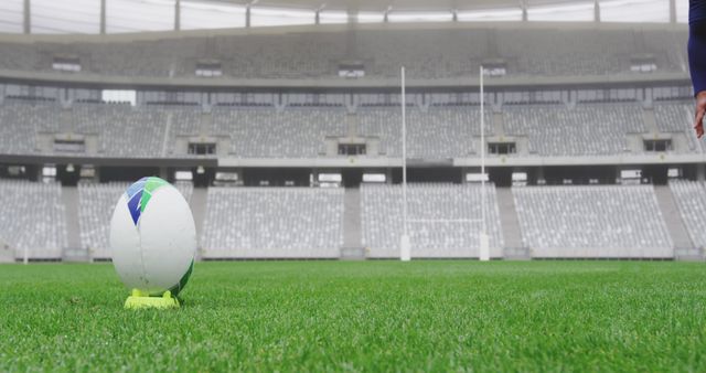 Rugby Ball on Field with Empty Stadium Background - Download Free Stock Images Pikwizard.com