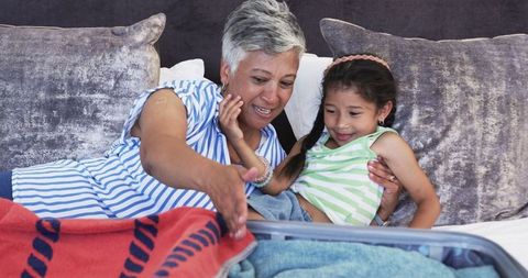 Grandmother Sharing Precious Moments with Granddaughter at Home