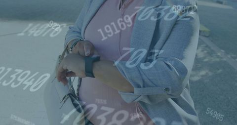 Businesswoman Using Smartwatch with Floating Numbers