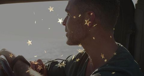 Mature Man Reflecting by Ocean in Car with Star Overlay