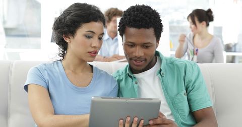 Colleagues Collaborating with Tablet in Creative Office Lounge - Download Free Stock Images Pikwizard.com