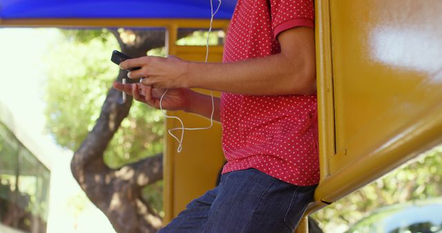 Teen Wearing Headphones and Using Smartphone - Download Free Stock Images Pikwizard.com