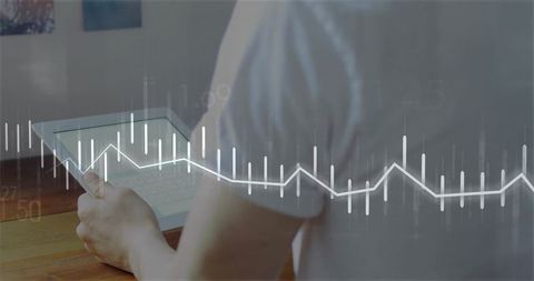 Asian Professional Holding Tablet Overlaid with Digital Chart