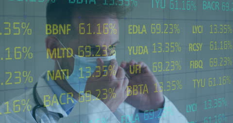 Doctor Analyzing Financial Data on Transparent Screen