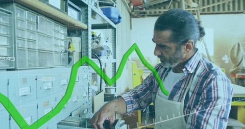 Carpenter Analyzing Growth Data in Workshop