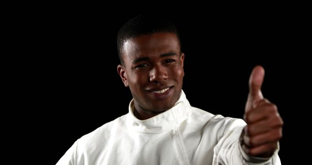 Confident African American Man Giving Thumbs Up in White Outfit - Download Free Stock Images Pikwizard.com