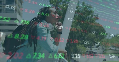 Pensive man reflecting stocks digital overlay