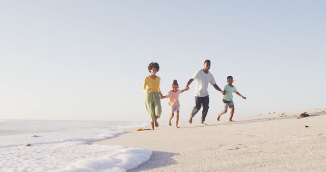 Happy Family Running on Seaside Beach at Sunset - Download Free Stock Images Pikwizard.com