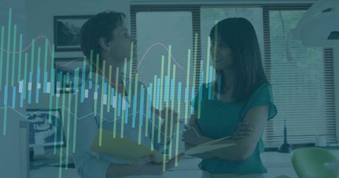 Dental team discussing patient files in modern clinic