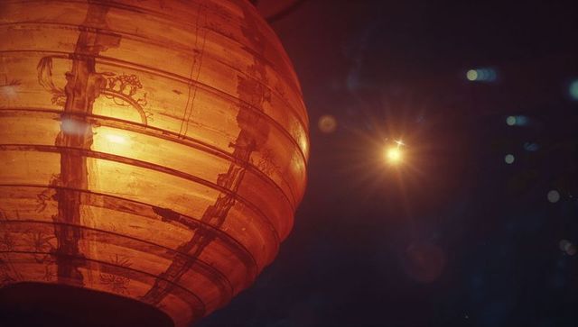 Glowing orange lantern illuminating night with warmth and craftsmanship