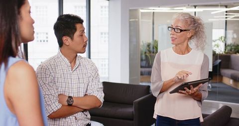 Colleagues Seizing Collaborative Ideas in Contemporary Office Setting