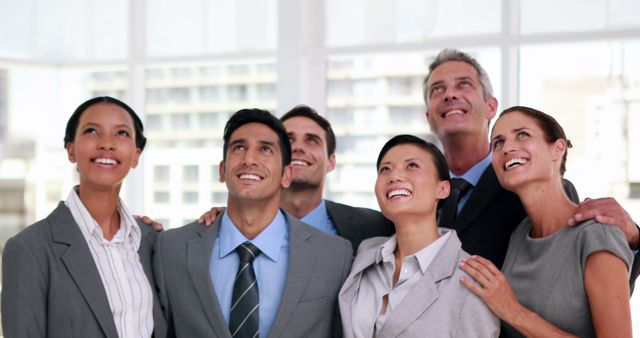 Diverse Business Team Looking Upward with Optimism in Modern Office - Download Free Stock Images Pikwizard.com